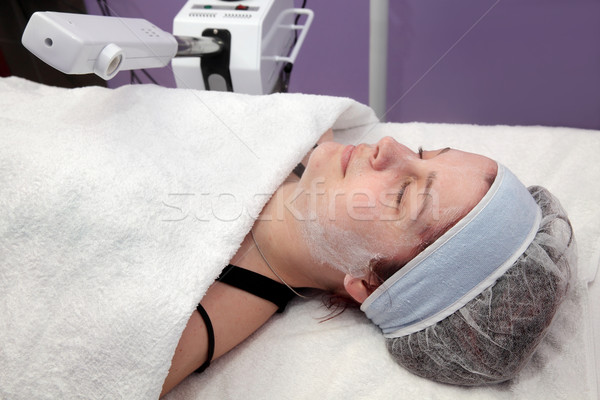 Beauty treatment of young female face, ozone facial steamer Stock photo © simazoran