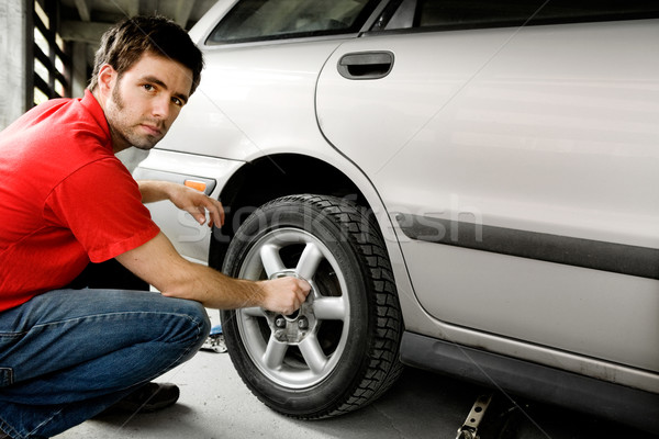 Male Changing Tire Stock photo © SimpleFoto