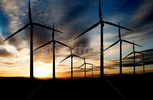 Parque eólico viento poder paisaje puesta de sol cielo Foto stock © SimpleFoto