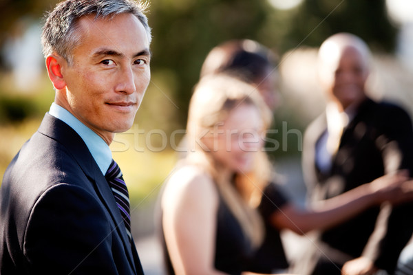 Hombre de negocios grupo gente de negocios fuera fuerte enfoque Foto stock © SimpleFoto