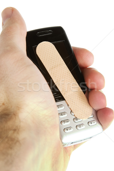 Celular dano adesivo bandagem homens mão Foto stock © SimpleFoto