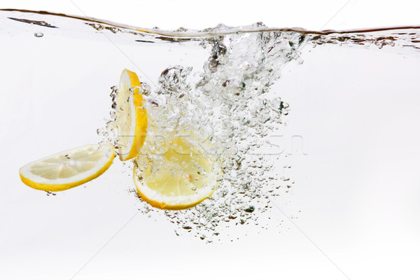 Gota de agua grupo limón rebanadas agua Foto stock © SimpleFoto