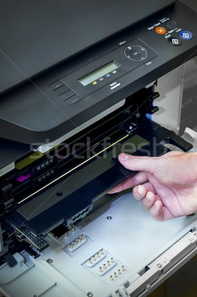 Man hand puts toner in the printer Stock photo © simpson33