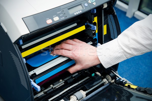 Man puts toner in the printer Stock photo © simpson33