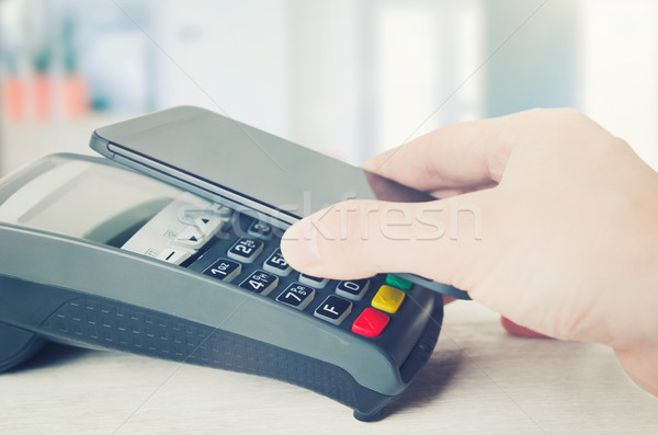 Mobile payment with smart phone Stock photo © simpson33