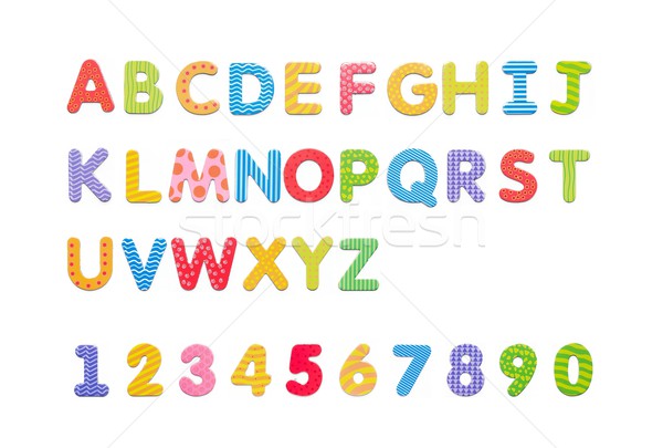 Stock photo: Colorful paper alphabet magnets on a whiteboard. Letters set iso