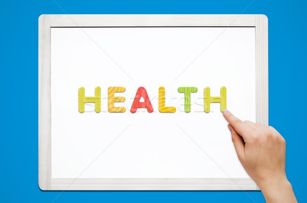 Mani parola salute magnetico lettere colorato Foto d'archivio © simpson33