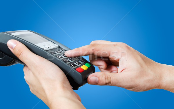 Hand with credit card swipe through terminal for sale Stock photo © simpson33