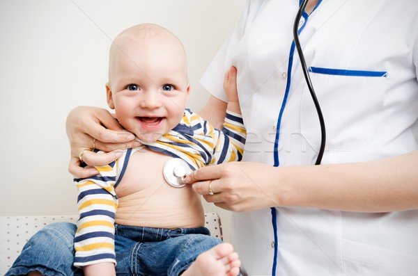 Little cute baby and doctor Stock photo © simpson33