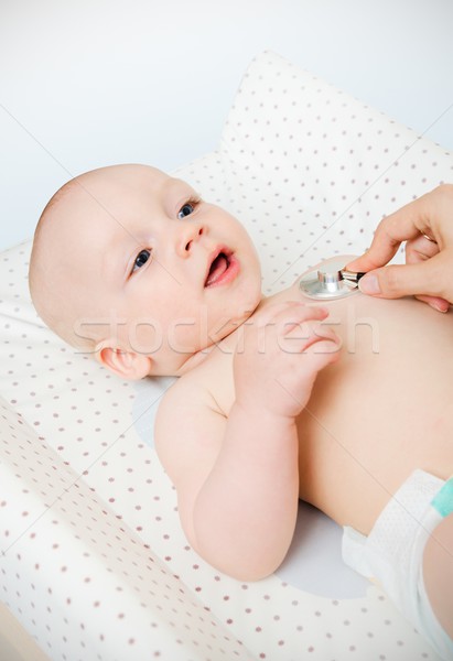 Child treated by a doctor Stock photo © simpson33