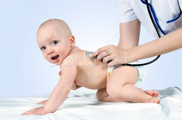 Child treated by a doctor Stock photo © simpson33
