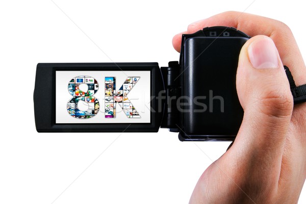 Hand holding Ultra High Definition camcorder isolated on white Stock photo © simpson33