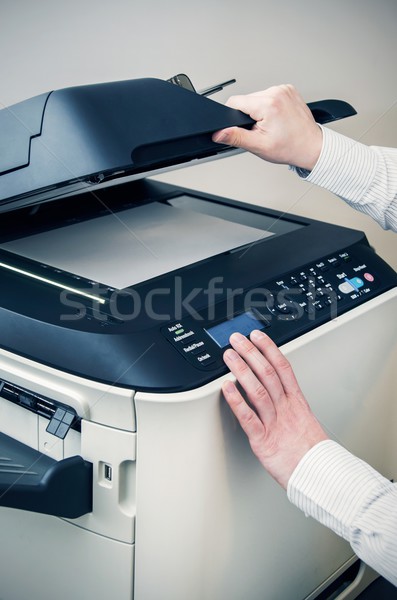 Man using scanner multifunction device in office Stock photo © simpson33