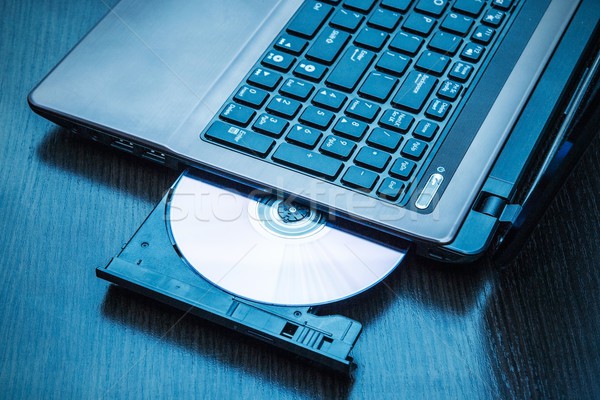 Laptop with open CD - DVD drive. Abstract light composition Stock photo © simpson33