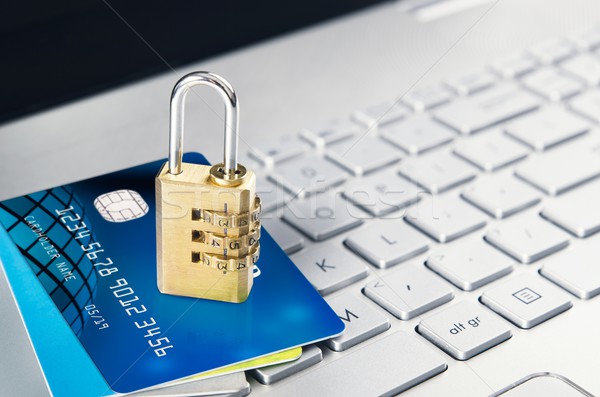 Laptop with padlock and credit cards on keyboard Stock photo © simpson33