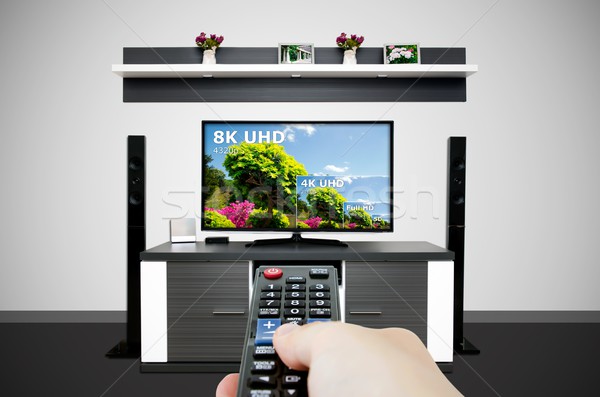 Watching television in modern TV room. Compare of television res Stock photo © simpson33