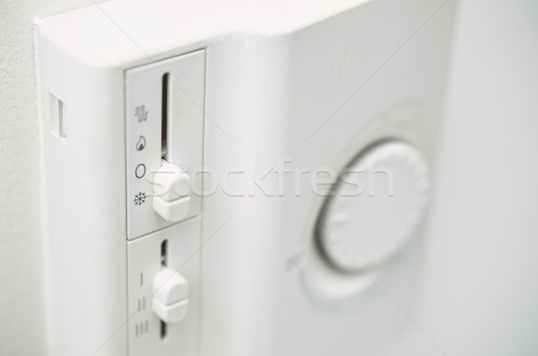Air conditioner thermostat on wall. Close up photo Stock photo © simpson33