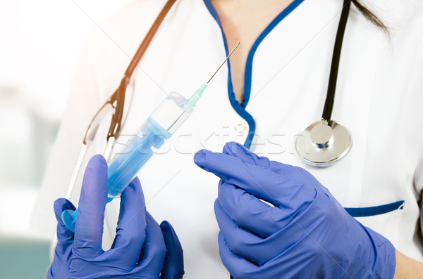 Donna medico guanti medici iniezione Foto d'archivio © simpson33