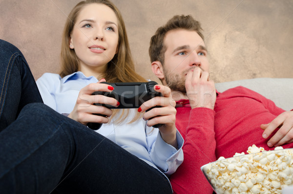 Paire temps libre jouer jeux vidéo jeu vidéo couple [[stock_photo]] © simpson33