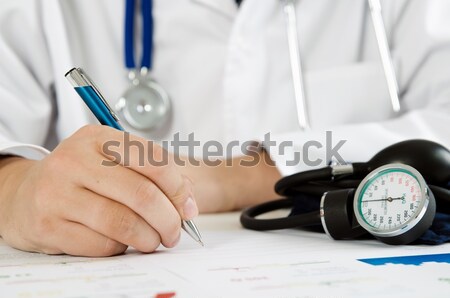 Doctor measuring blood pressure Stock photo © simpson33