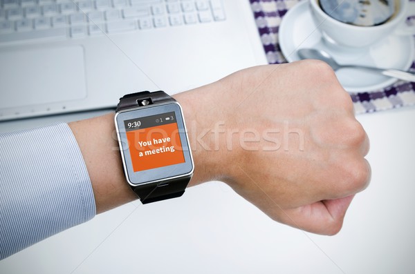 Businessman working with smart watch in restaurant Stock photo © simpson33