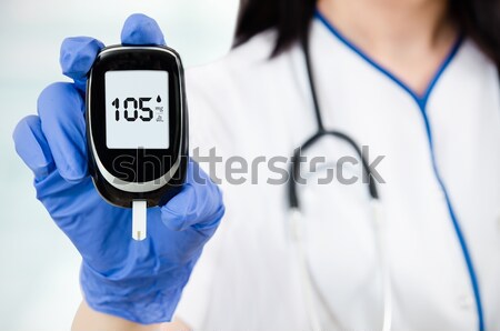 Stock photo: Doctor making blood sugar test. Healthcare, diabetes, medical co