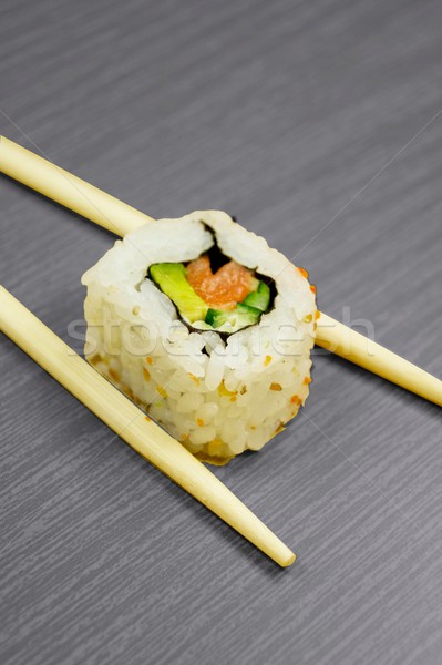 Sushi and sticks isolated on black wooden board Stock photo © simpson33