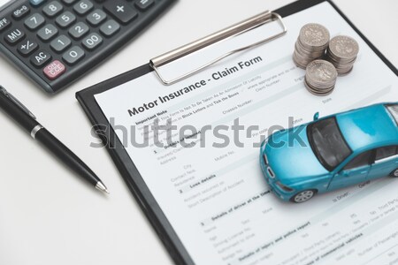 Car toy and keys on insurance documents . Protection car concept Stock photo © simpson33