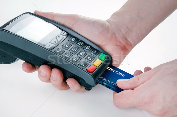 Hand with credit card swipe through terminal for sale Stock photo © simpson33