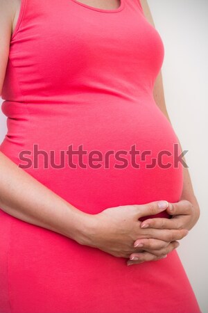 Zwangere vrouw aanraken buik vrouw borst zwangere Stockfoto © simpson33