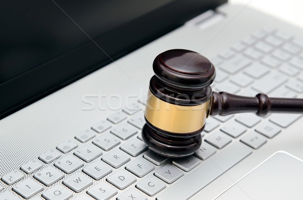 Stock photo: Wooden judge hammer on laptop computer white keyboard