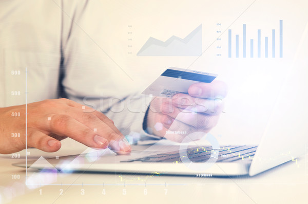 Man using laptop at workplace Stock photo © simpson33