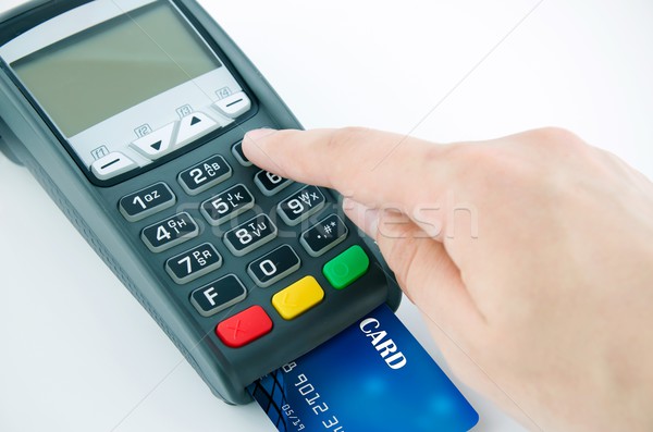 Man using payment terminal keypad, enter personal identyfication Stock photo © simpson33