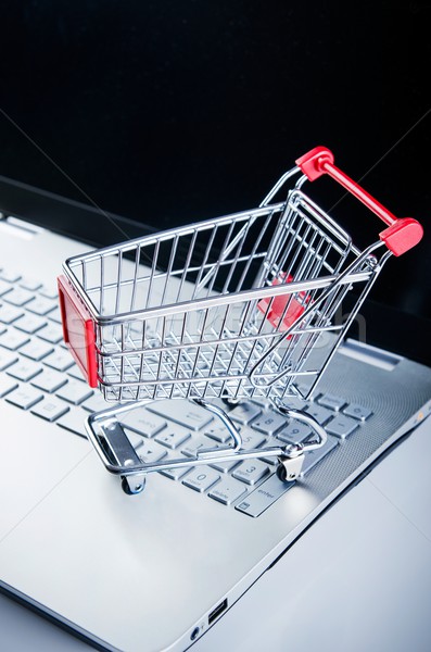 Internet shopping concept. Basket on laptop keyboard Stock photo © simpson33