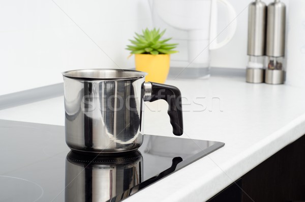 Mug in modern kitchen with induction stove Stock photo © simpson33