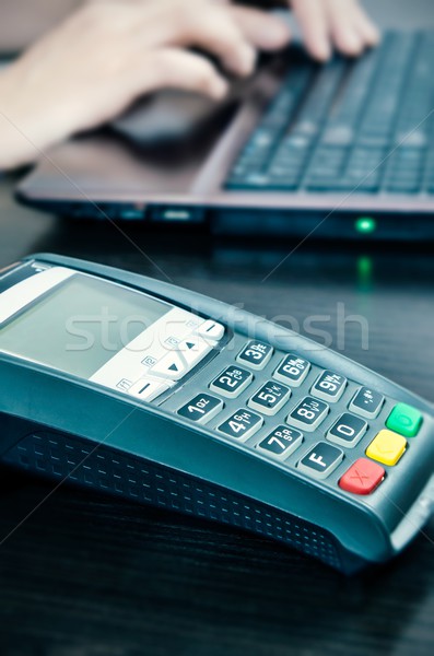 Payment terminal in the office. Man working with laptop in the b Stock photo © simpson33
