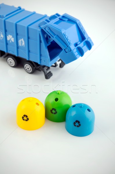 Colored trash bins and garbage truck toys on white background Stock photo © simpson33