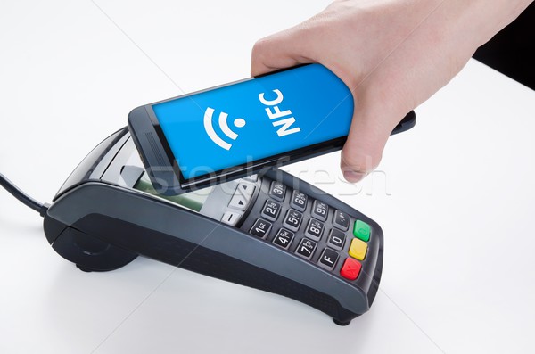 Mobile payment with NFC near field communication technology Stock photo © simpson33