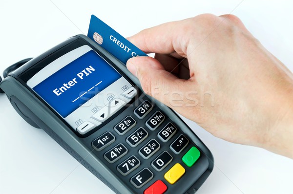 Hand with credit card swipe through terminal for sale. Enter PIN Stock photo © simpson33