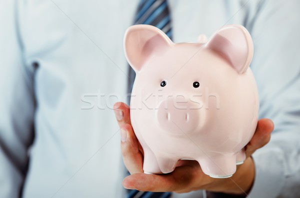 Homem de negócios piggy bank mão poupança dinheiro Foto stock © simpson33
