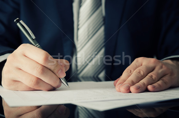 Businessman signs a contract Stock photo © simpson33