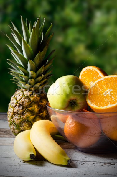 Stock photo: Lot of fresh fruits on wooden background