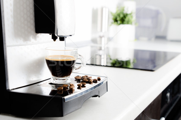 Professional home coffee maker in modern kitchen Stock photo © simpson33