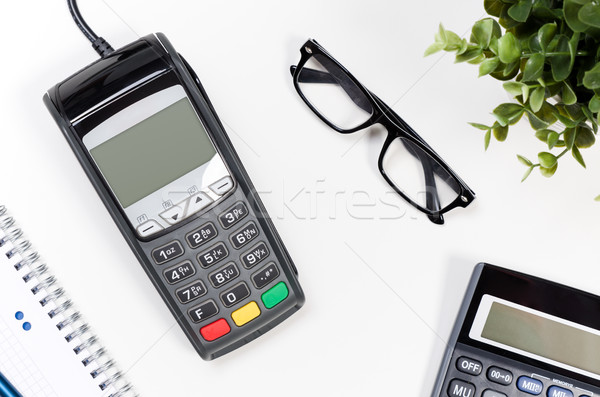 Office desk table with payment terminal and calculator Stock photo © simpson33