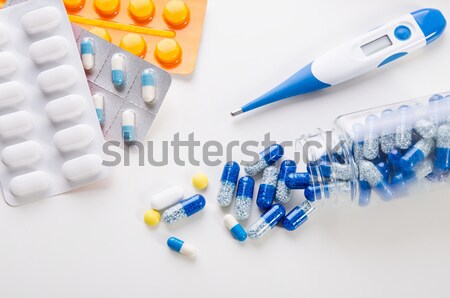 Pile of scattered capsules on a white background Stock photo © simpson33