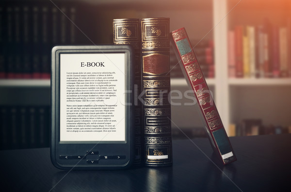 E-book reader device on desk in library Stock photo © simpson33