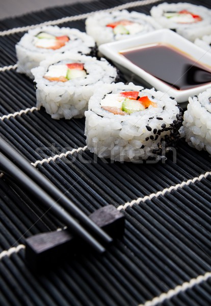 Sushi set on black bamboo mat Stock photo © simpson33