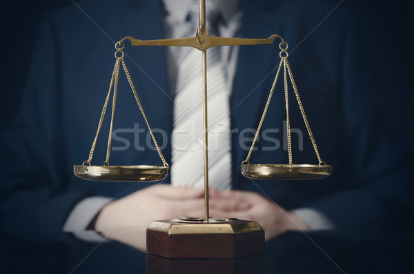 Weight scale of justice, lawyer in background Stock photo © simpson33