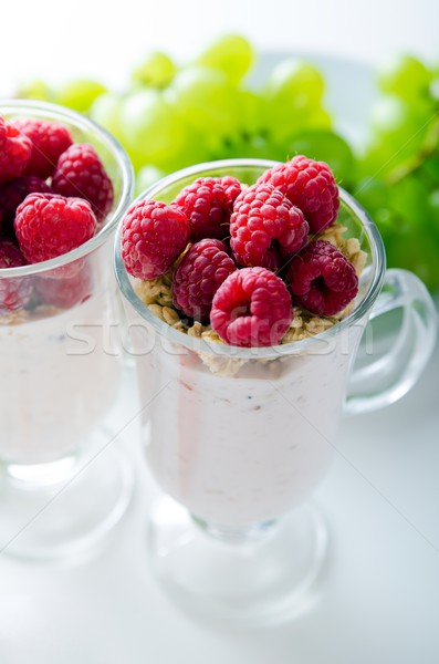 Glass of dessert with yoghurt, fresh berries and muesli Stock photo © simpson33