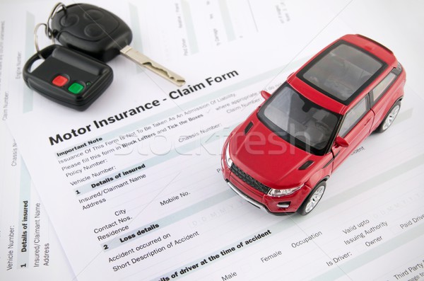 Car toy and keys on insurance documents . Protection car concept Stock photo © simpson33